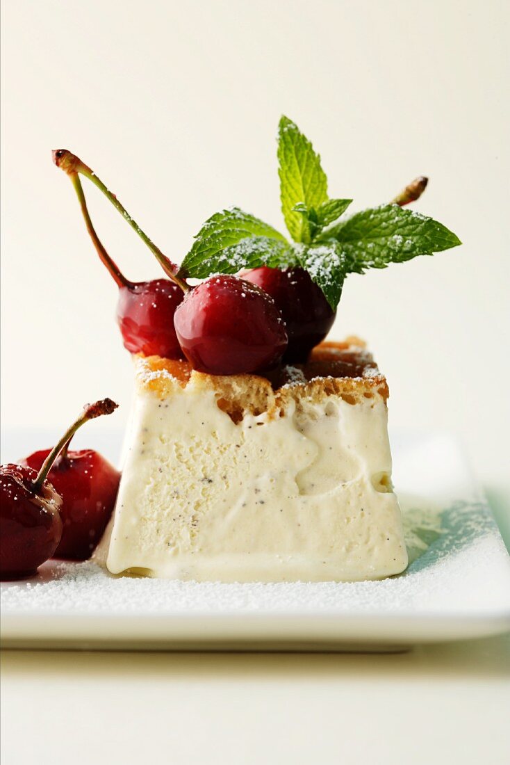 Vanilla ice cream tartlet with cherries and mint