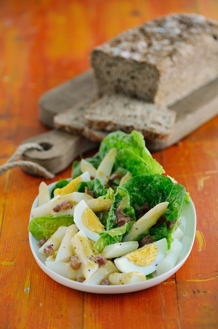 An asparagus salad with cos lettuce and eggs
