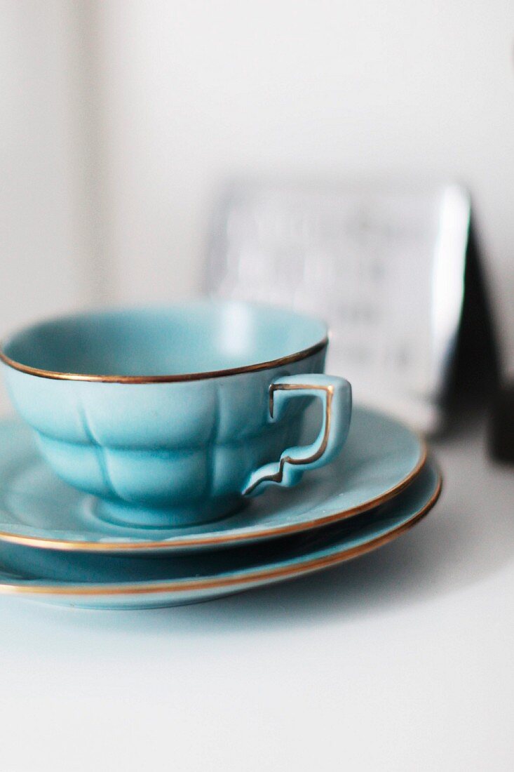 Light blue, retro teacup and two saucers