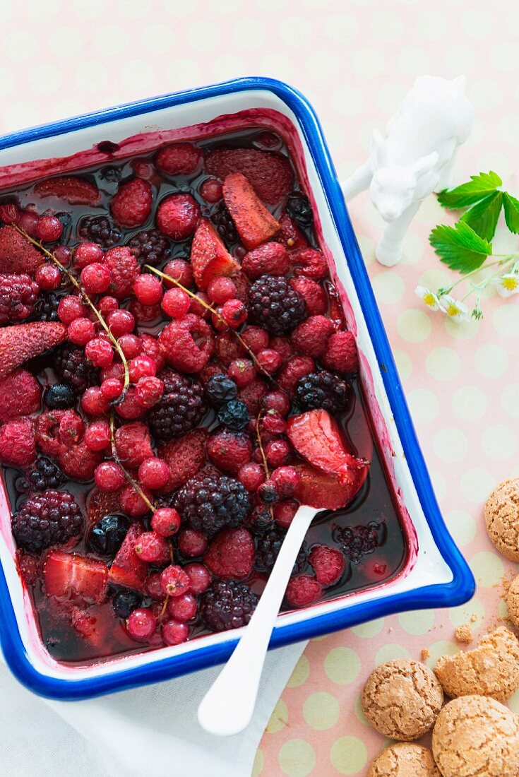 A baked berry salad with almond biscuits