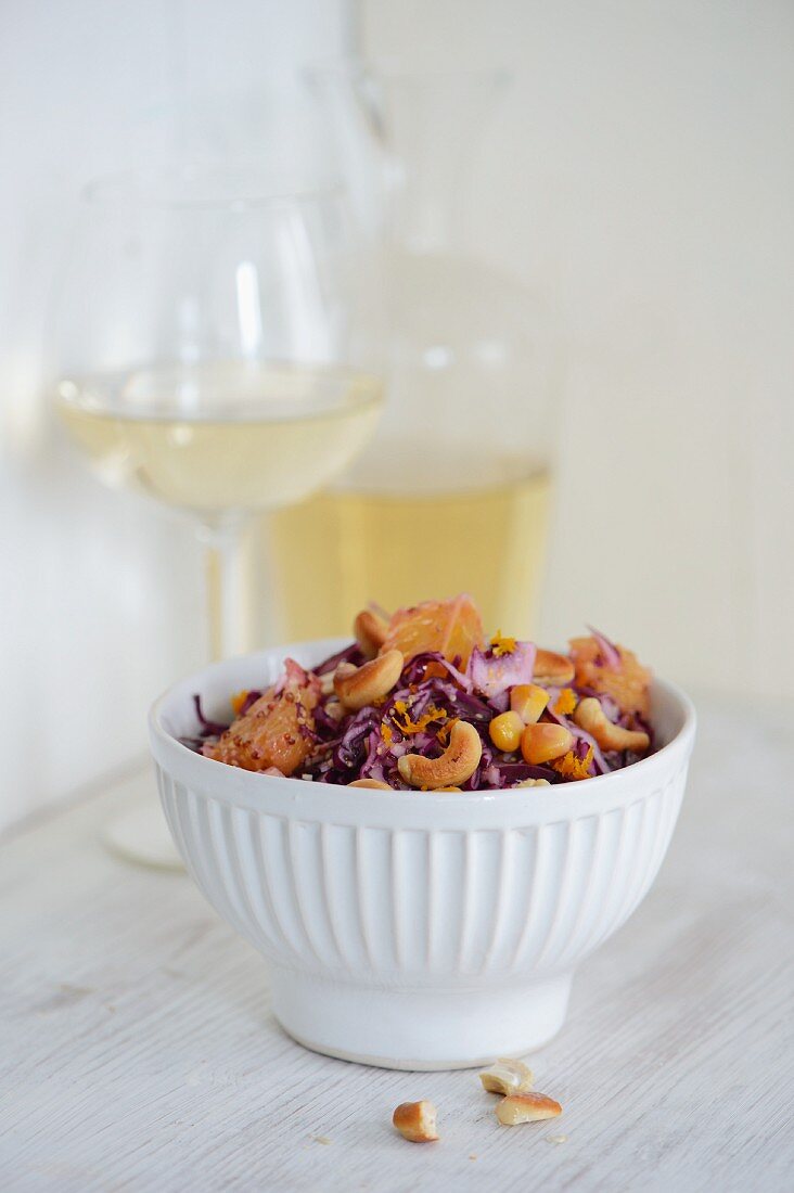 Red cabbage salad with orange and cashew nuts