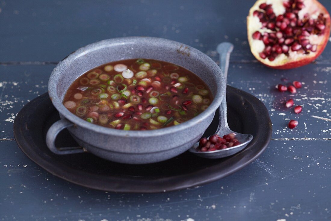 A pomegranate dressing with spring onions
