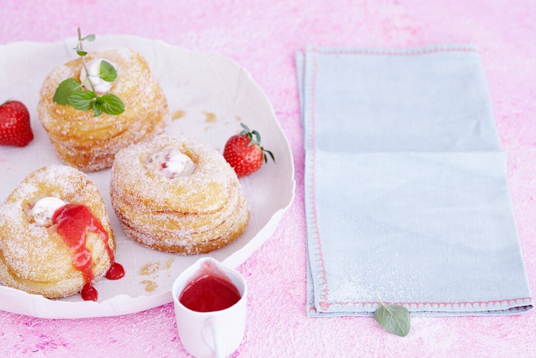 Croissant-Doughnuts with ice cream and strawberry sauce