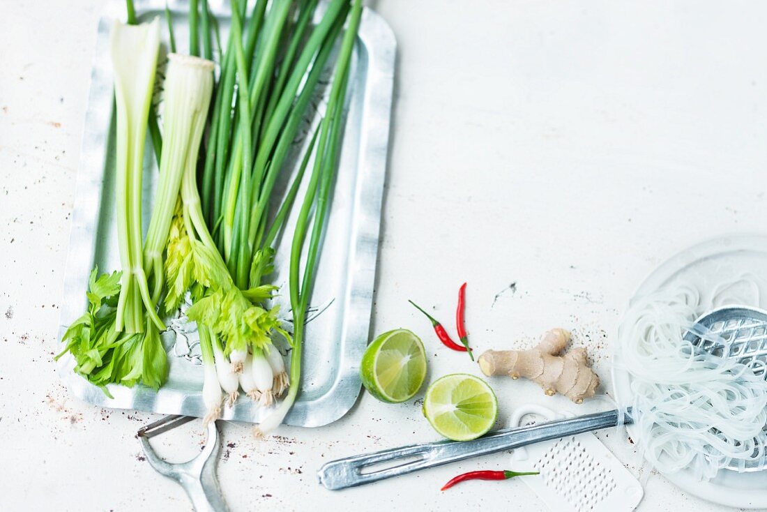 An arrangement of rice noodles, vegetables and spices for oriental cuisine