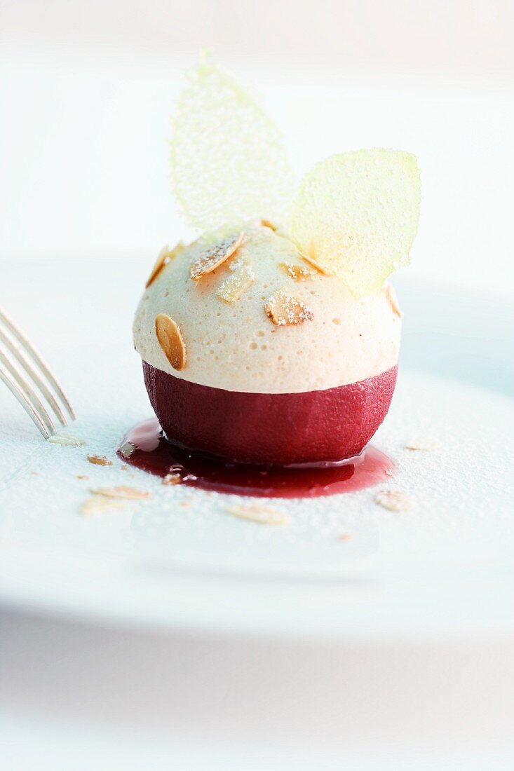A poached mulled wine apple with gingerbread mousse