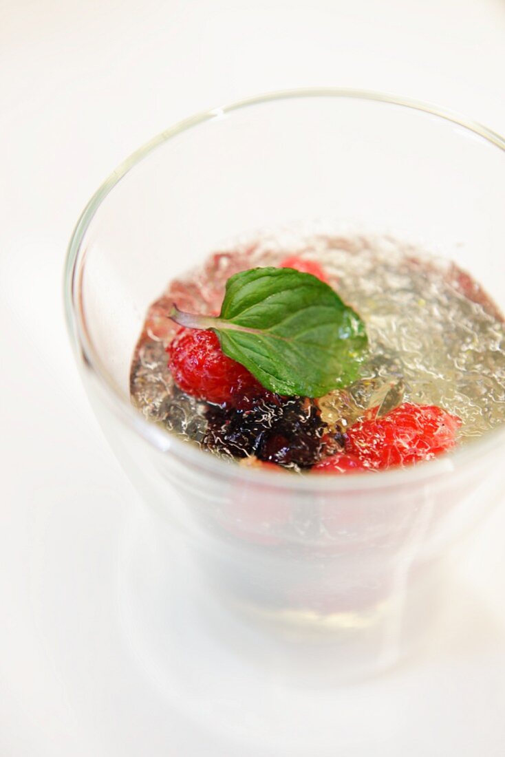 Champagne jelly with raspberries, blackberries and mint