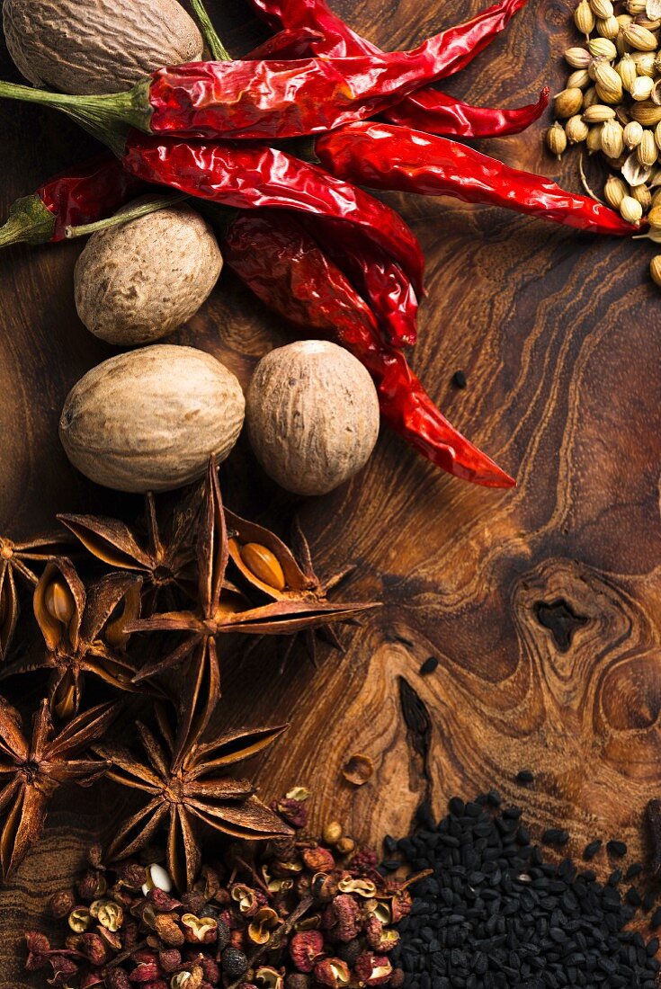 Assorted spices on wooden board