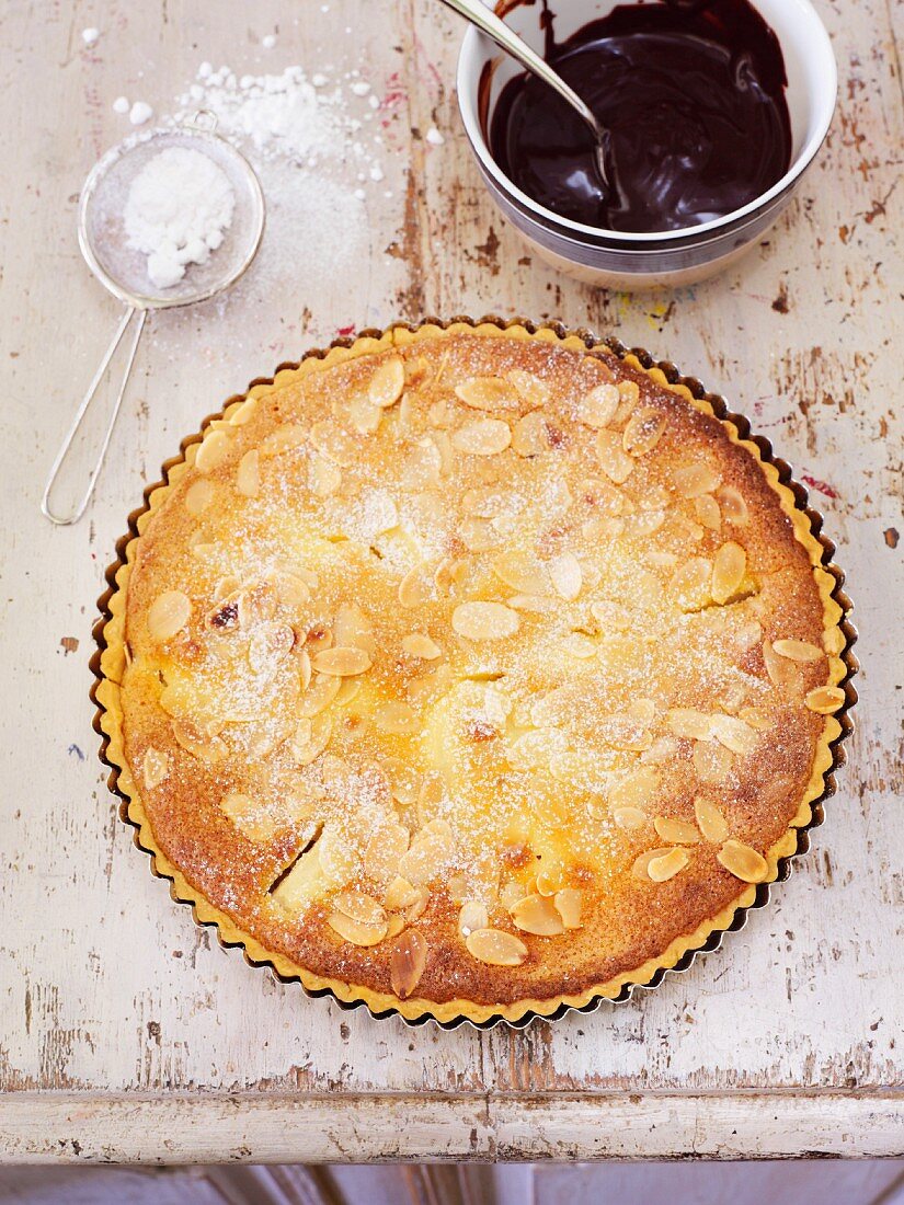 Pear and almond tart with a chocolate and cherry sauce