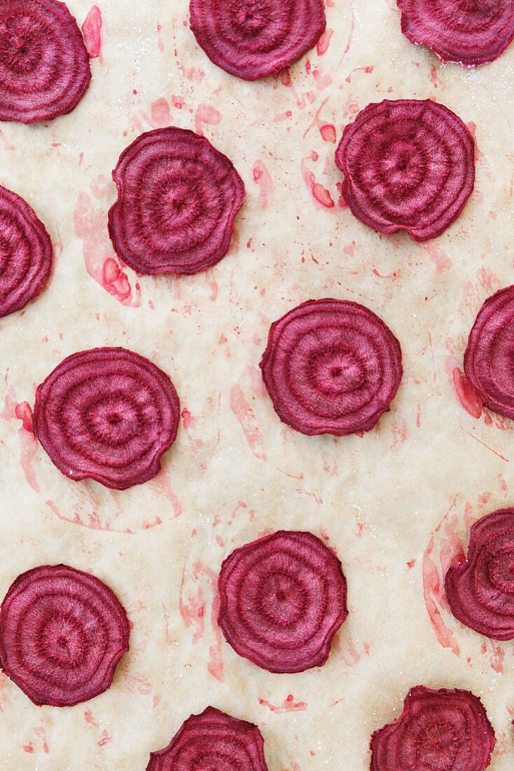 Baked slices of beetroot on baking paper