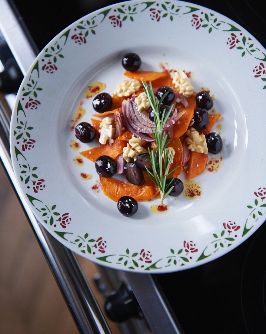 Roasted pumpkin with grapes, rosemary, onions and nuts