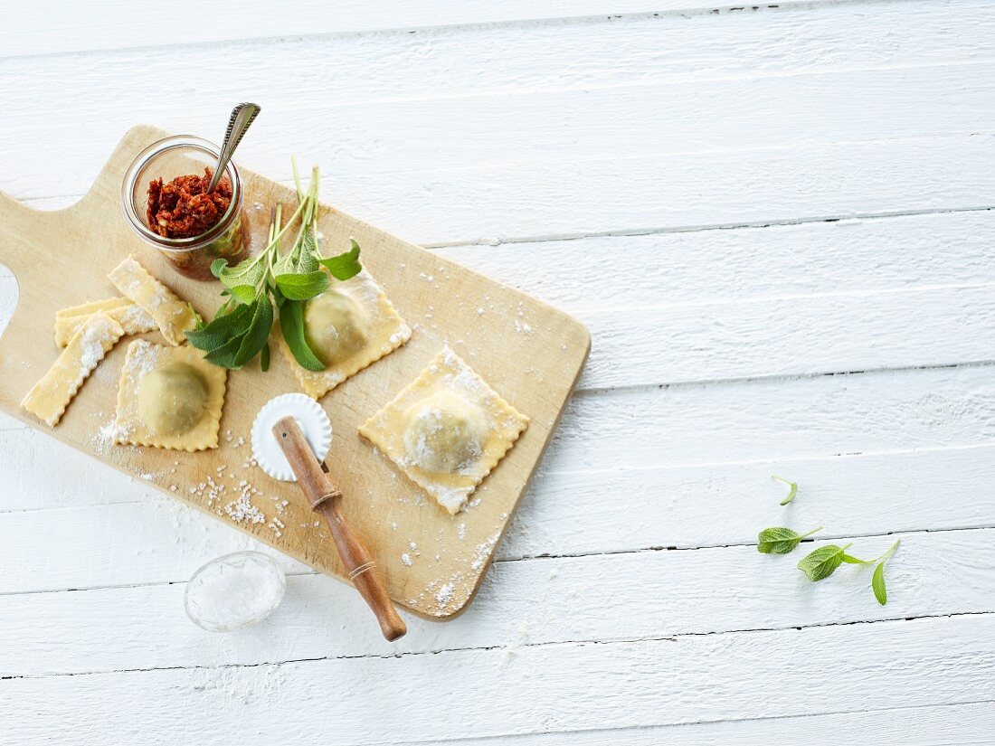 Homemade ravioli on a chopping board