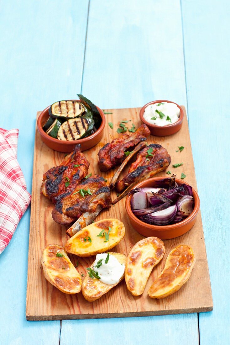 Grilled vegetables and meat with baked potatoes