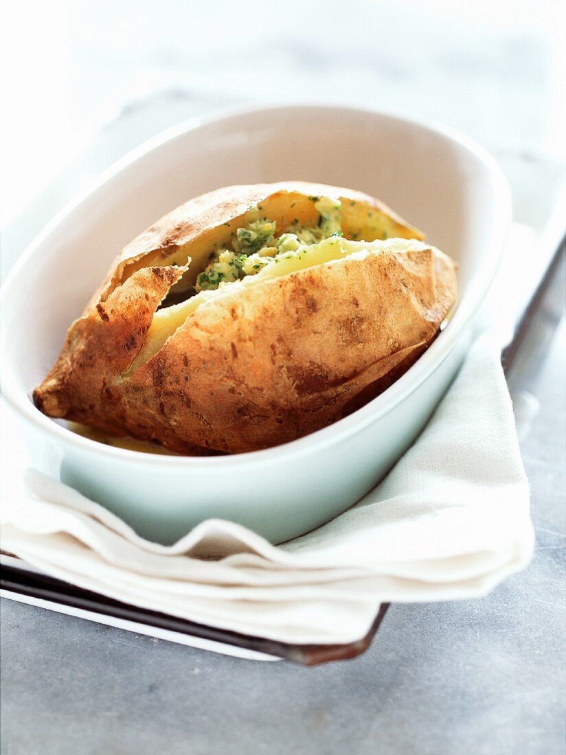 Baked sweet potato with orange and coriander butter
