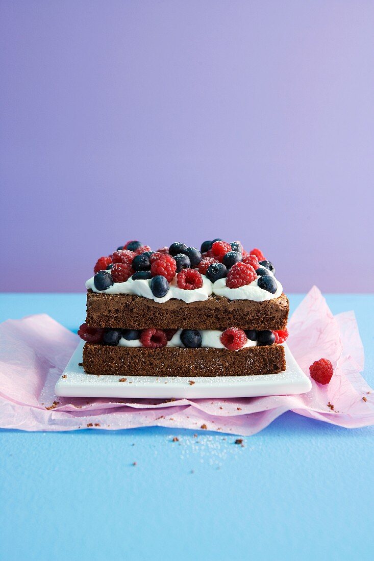Chocolate-rum cake with cream and fresh berries