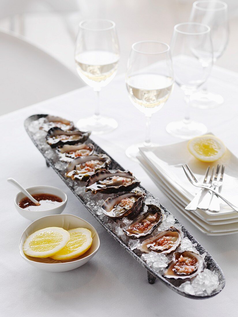 Oysters with vinaigrette and lemon slices