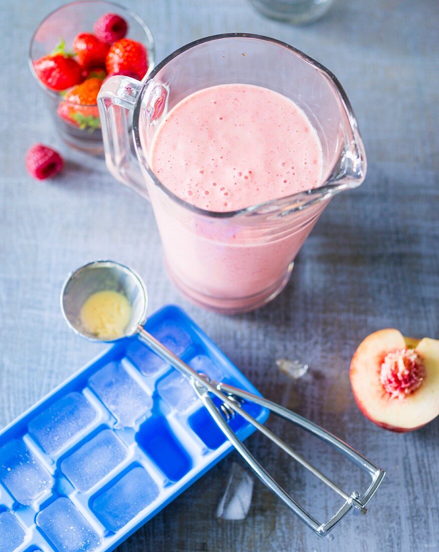 A Melba smoothie made with peaches, berries and vanilla ice cream