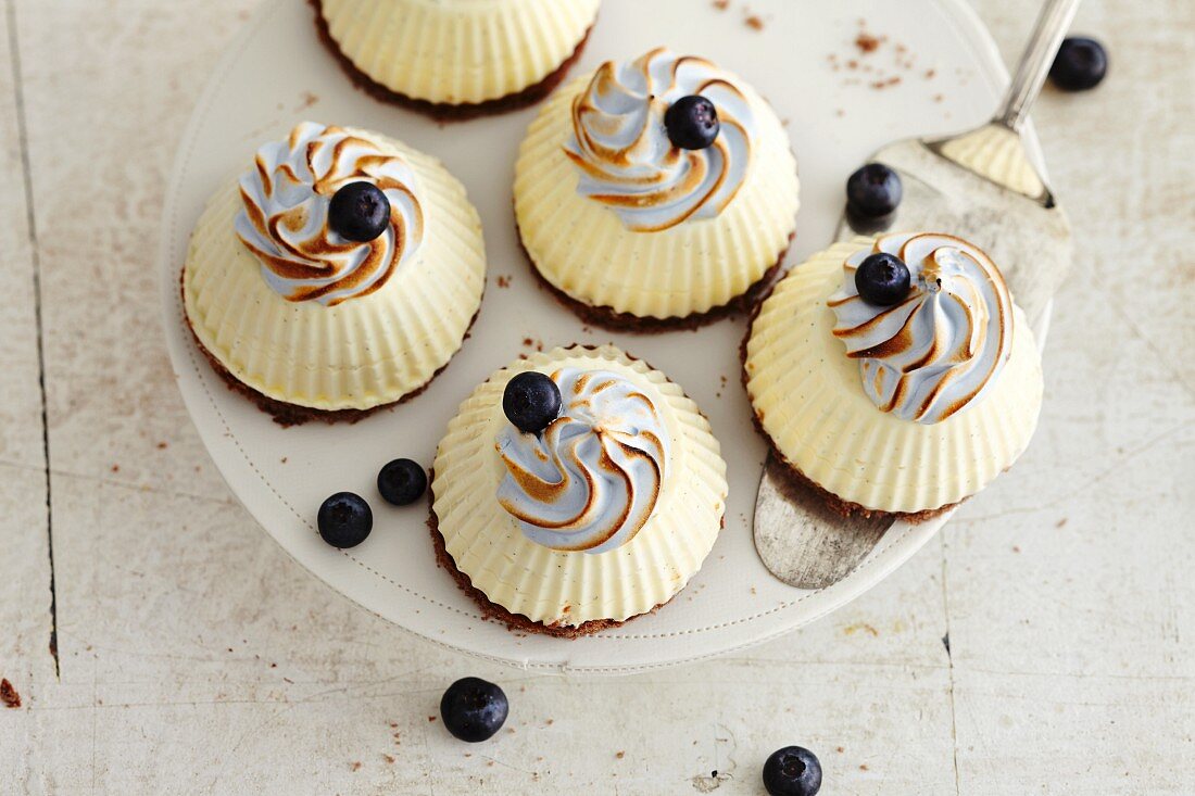 White chocolate mousse cakes topped with meringue