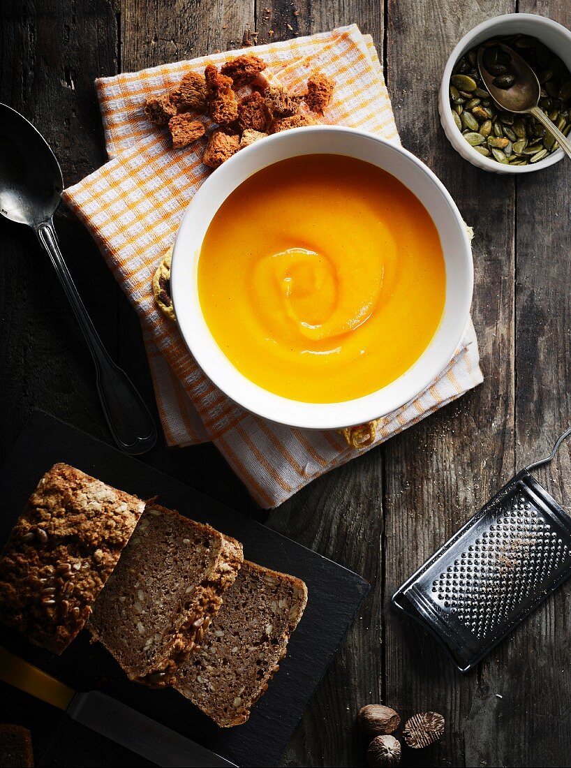 Butternut squash soup, croutons, pumpkin seeds and wholemeal bread