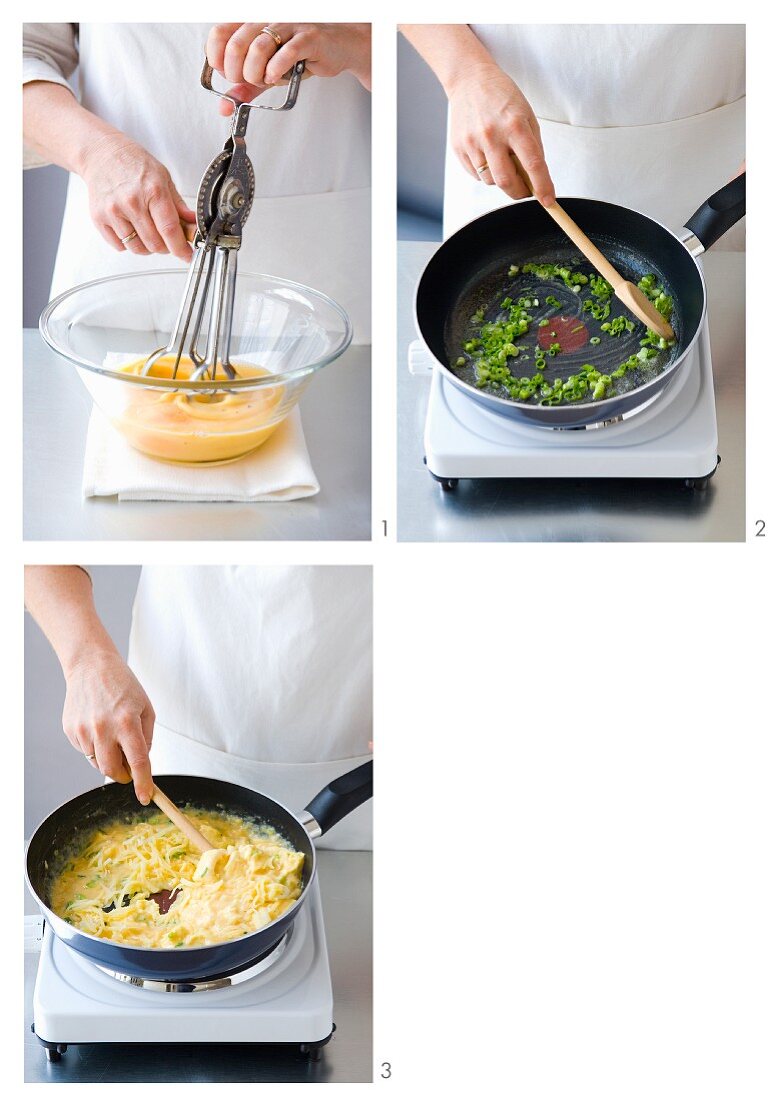 Scrambled egg with spring onions being made