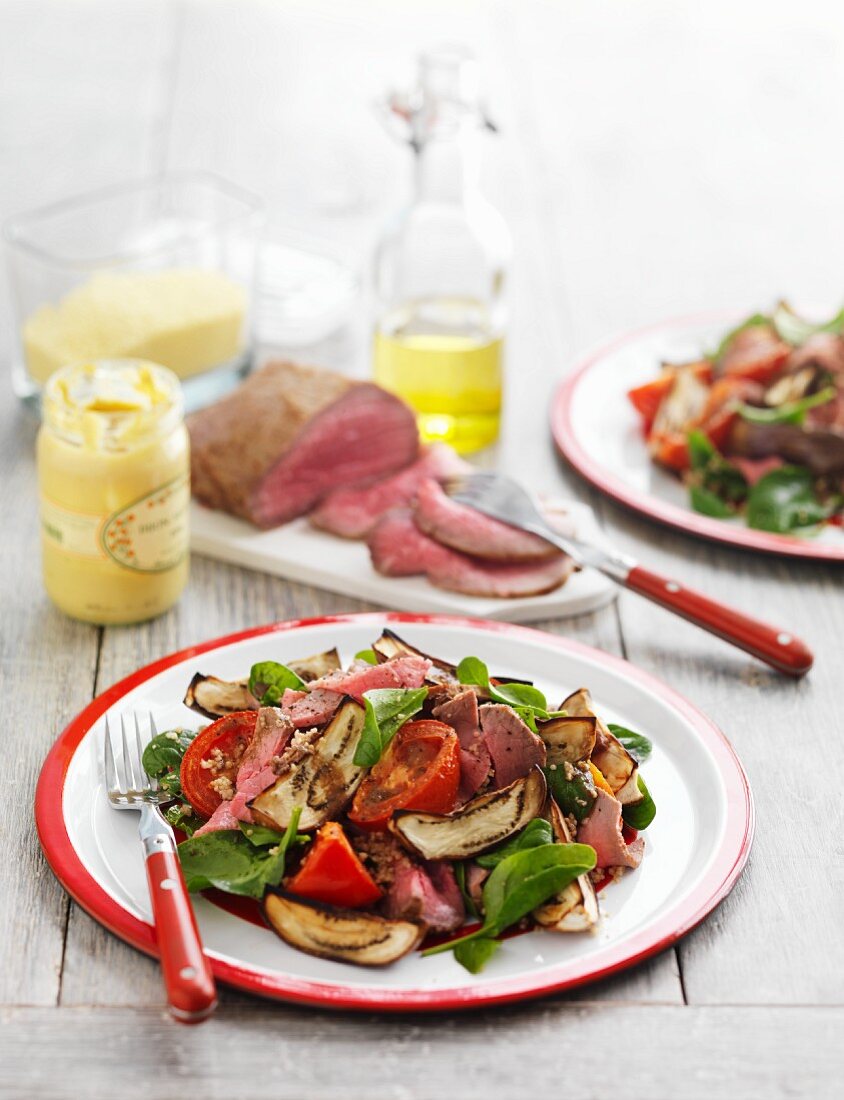 A beef, aubergine, spinach and tomato salad