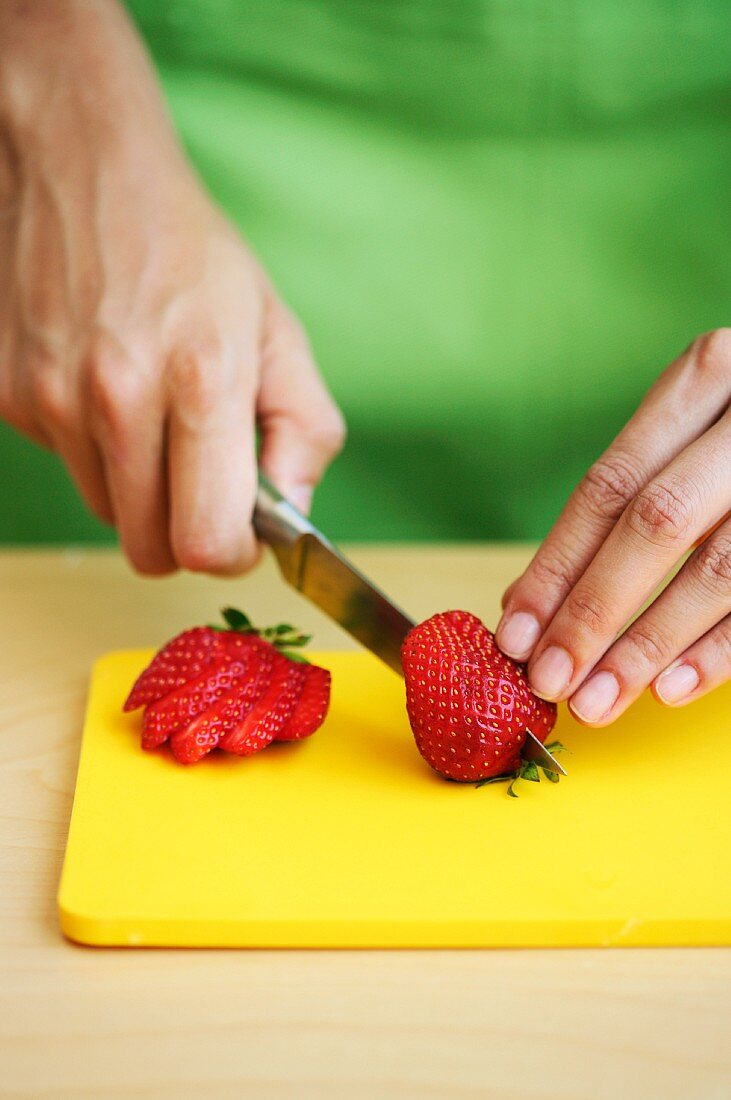 Strawberries being sliced