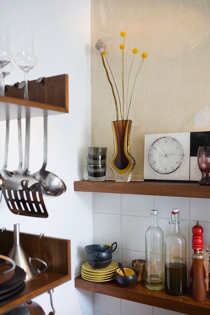 Crockery and utensils on kitchen shelves