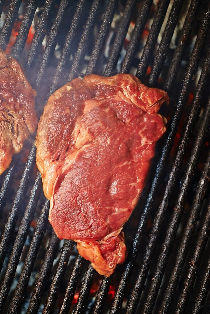 A beef steak on a barbecue