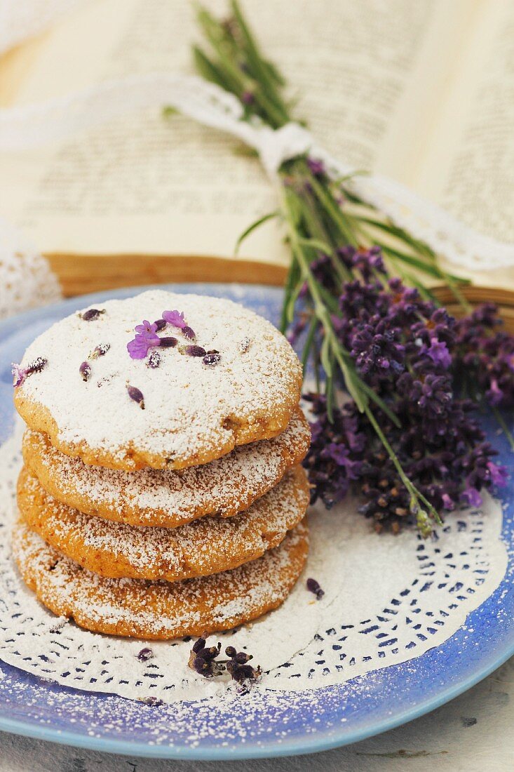 A stack of lavender biscuits on a plate