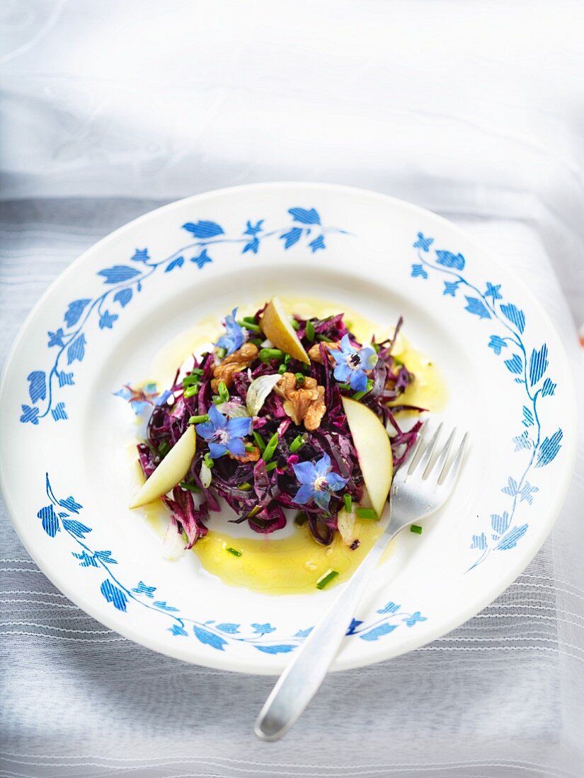 Red cabbage salad with apple and borage flowers