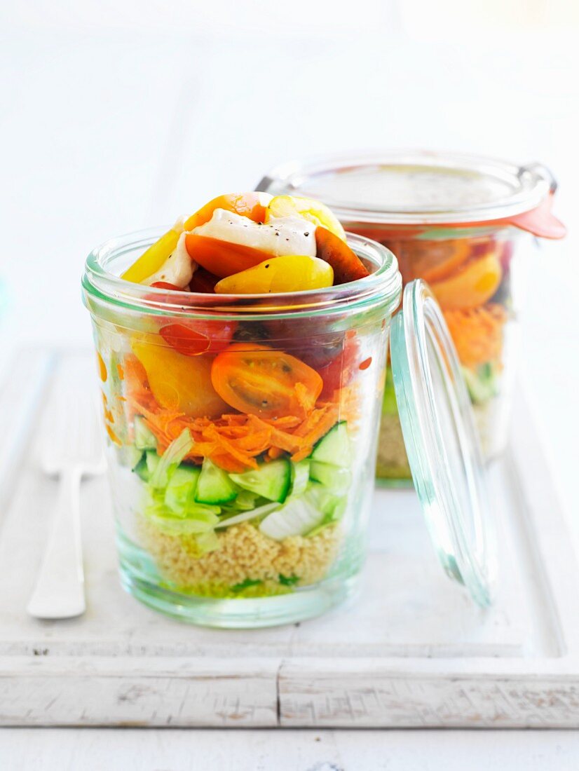 Couscous and vegetable salad in jars