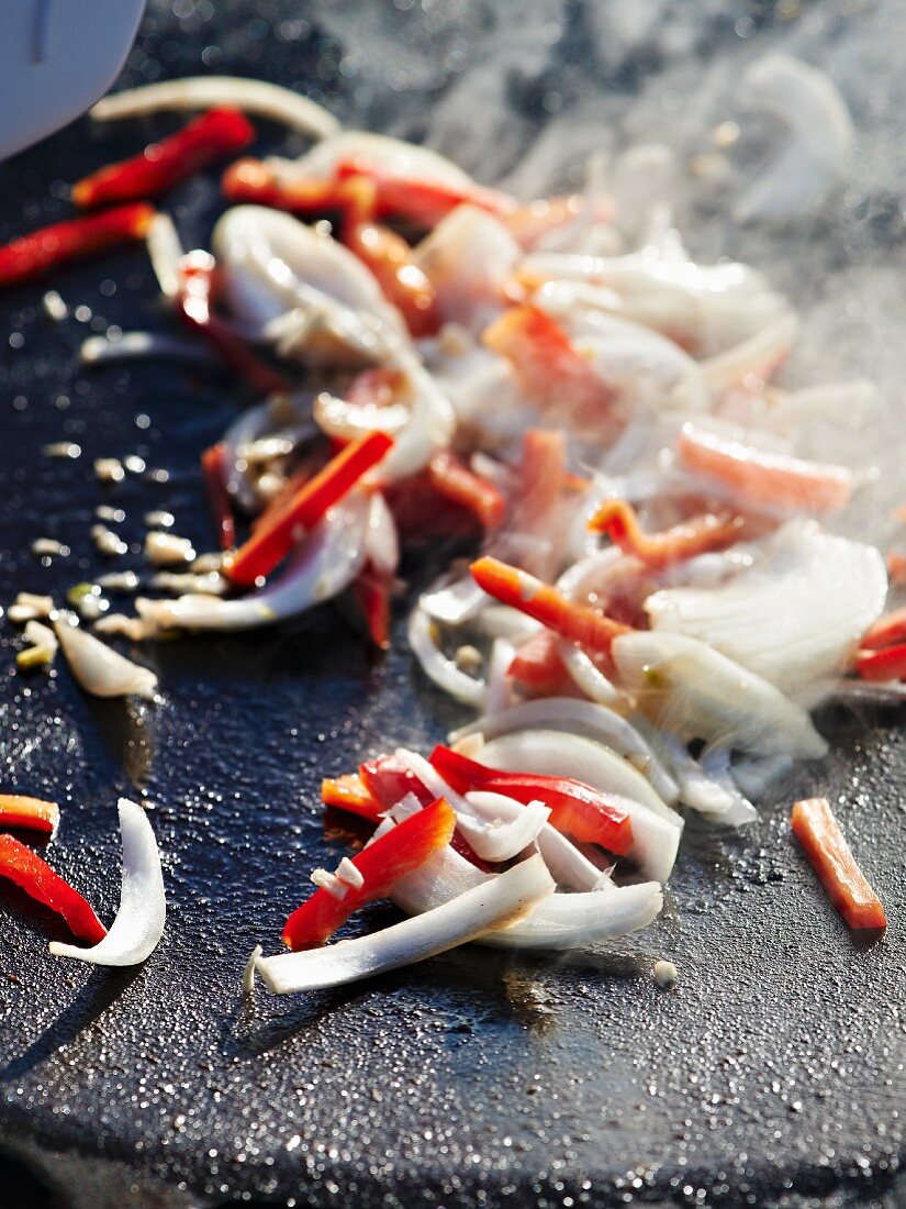 Grilled onions and peppers for a winter picnic