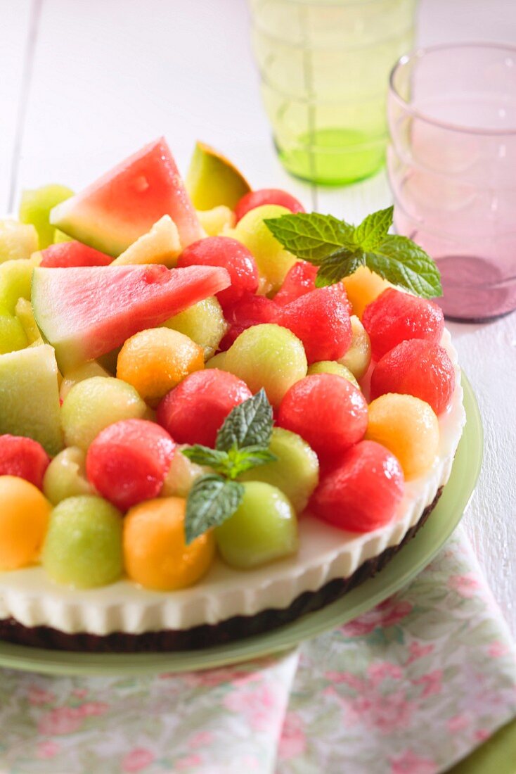 Cream cheese cake topped with colourful melon balls