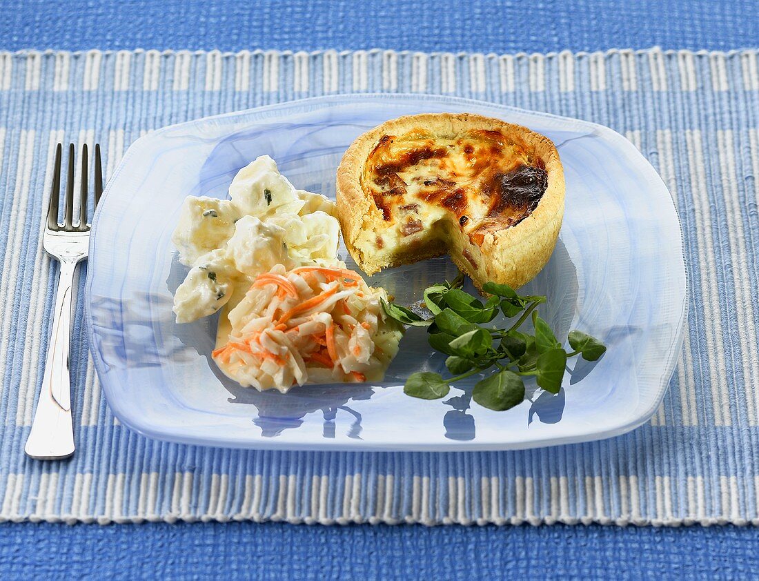 A mini quiche with a side of vegetables
