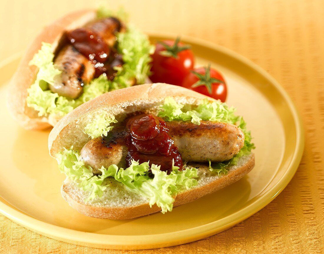 A sausage sandwich with barbecue sauce