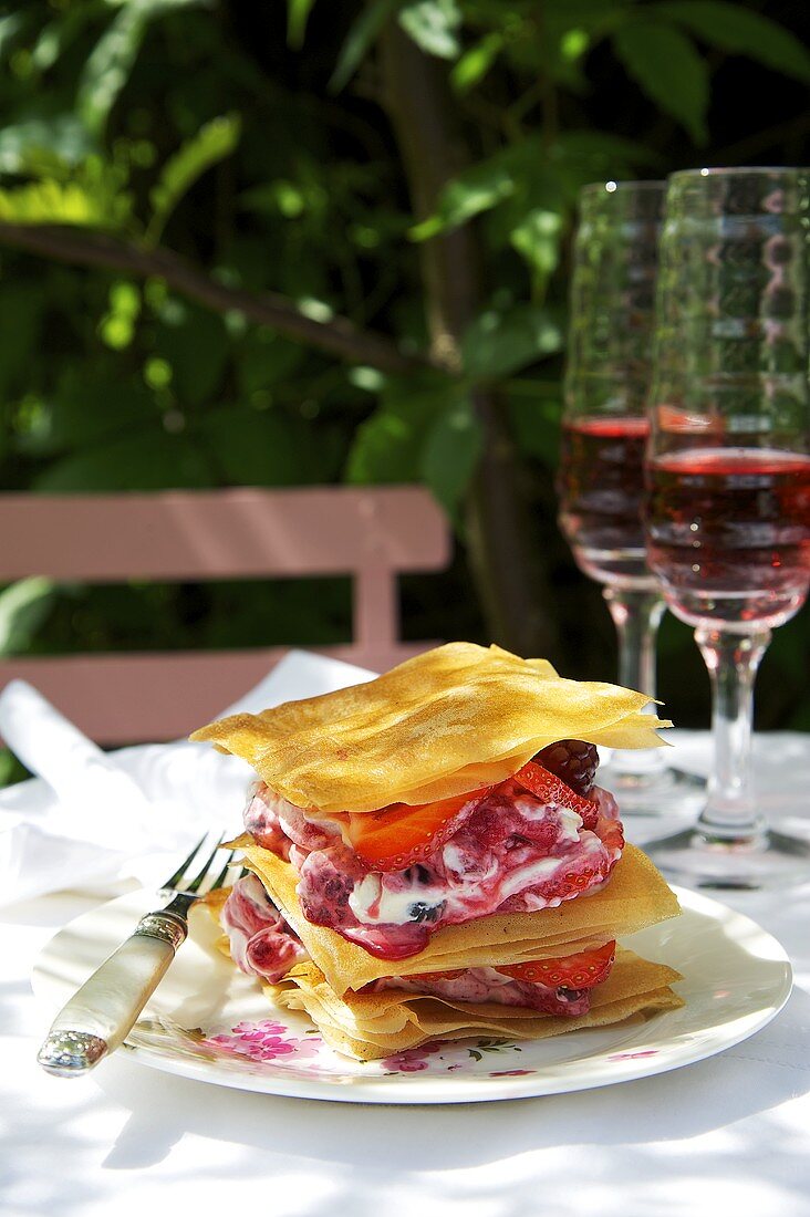 A layered dessert made with filo pastry and berries