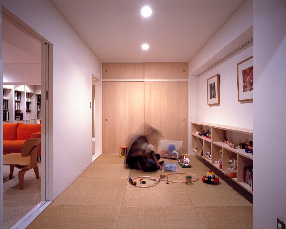 Man and child in a play room on tatami mats