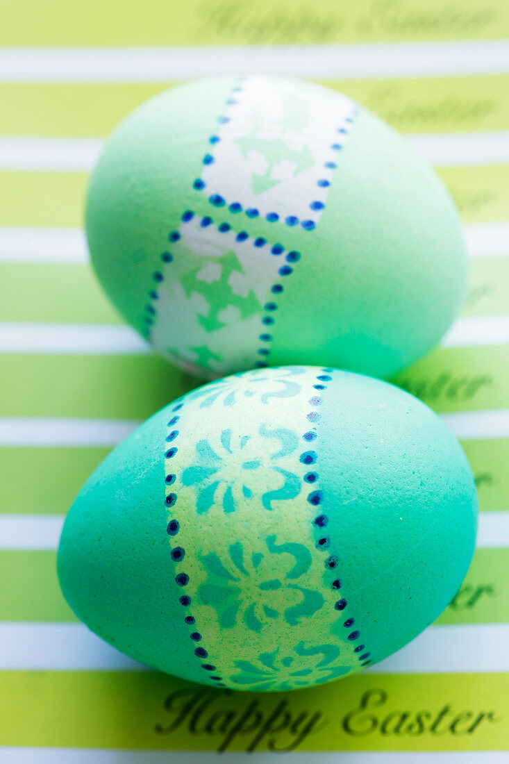 Green Easter eggs on an Easter card