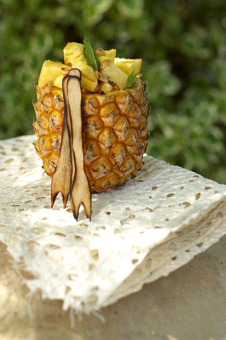 A pineapple filled with peanuts and chilli
