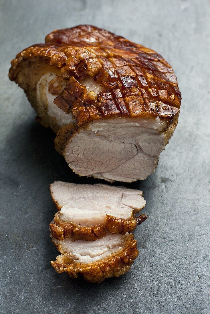 Roast pork with crackling, partly carved