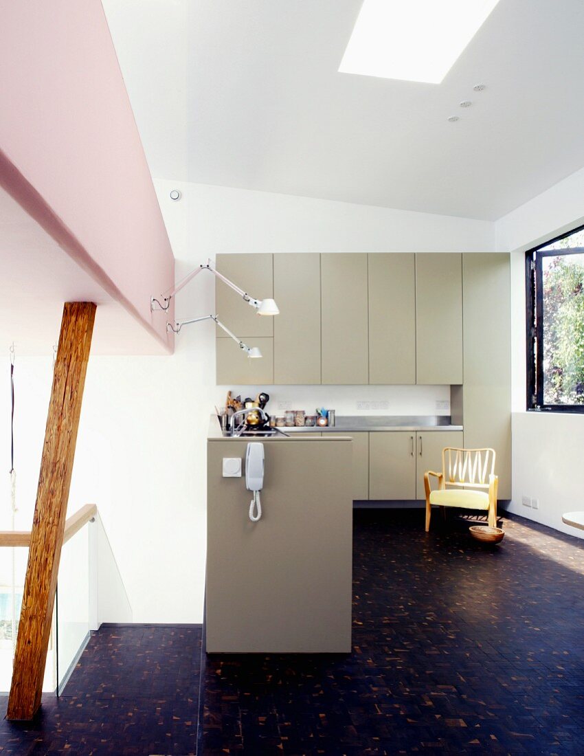 Open kitchen with bright gray cabinets and dark wooden floor