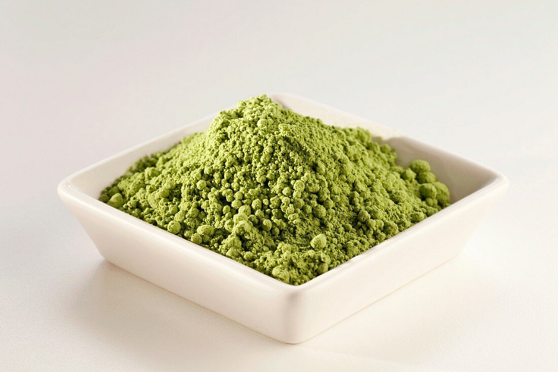 Japanese Matcha Green Tea Powder in a White Dish; White Background