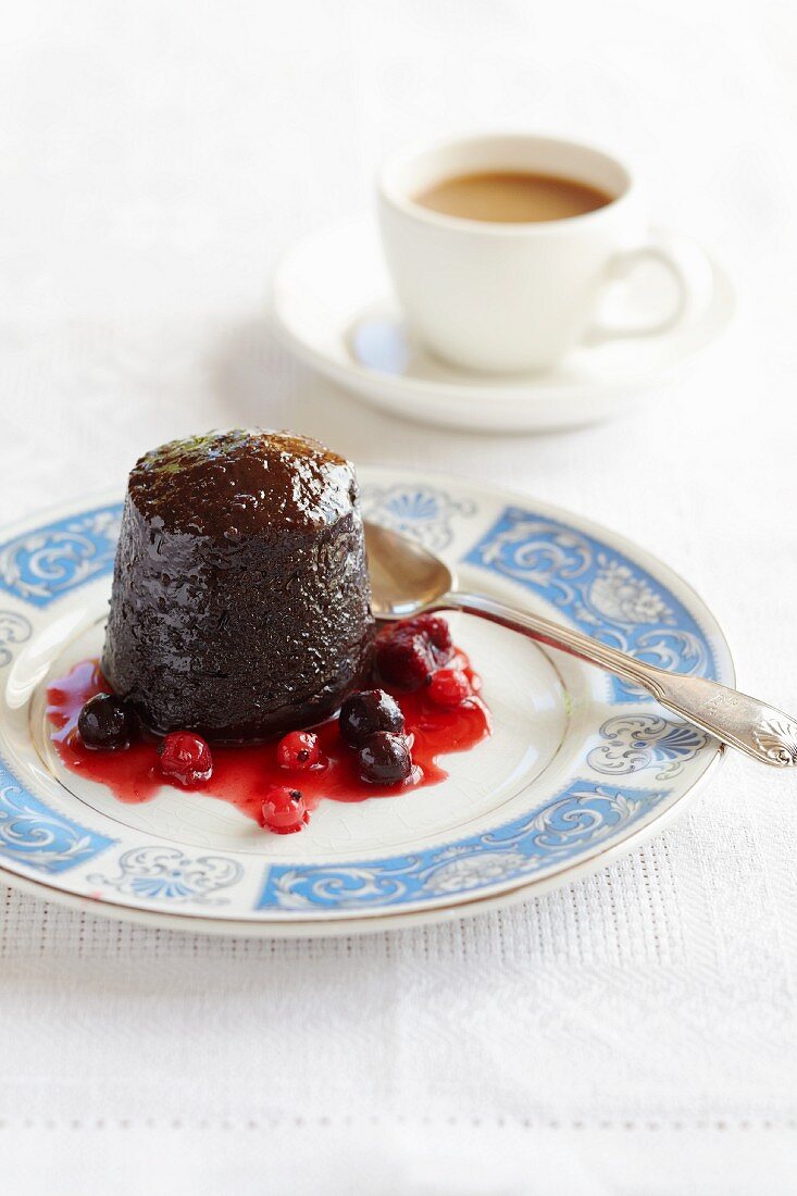 Chocolate pudding with berry sauce