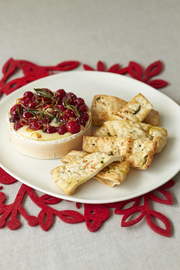Oven baked Camembert with cranberries and bread