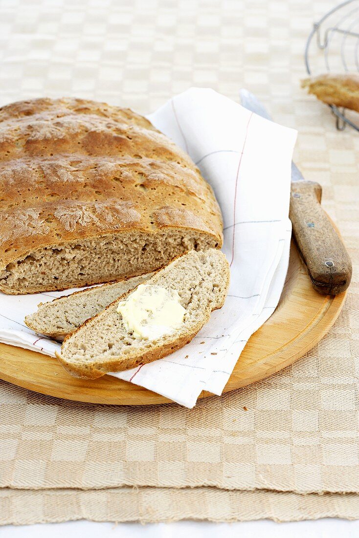Wholegrain bread, sliced, with butter