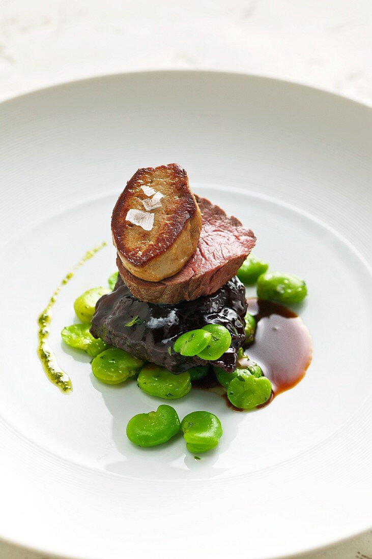 Braised Alpine ox with fried goose liver and broad beans