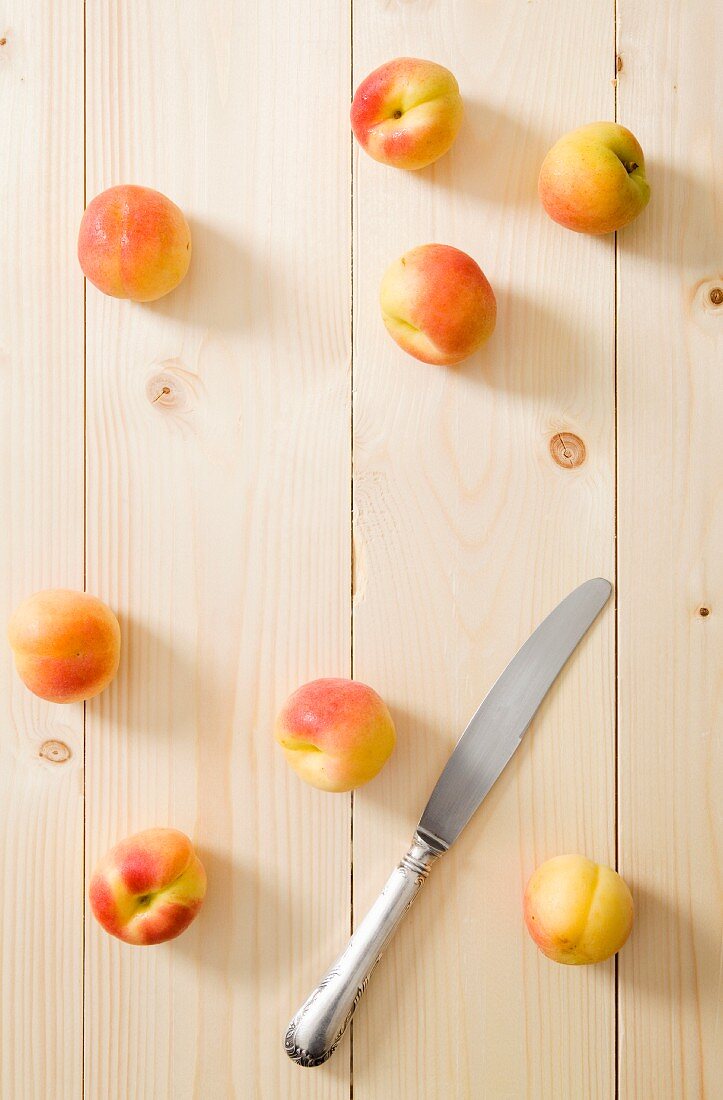 Fresh apricots on a wooden surface