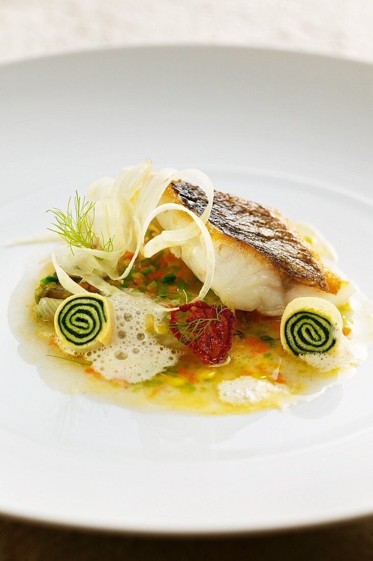 Bass in vegetable broth