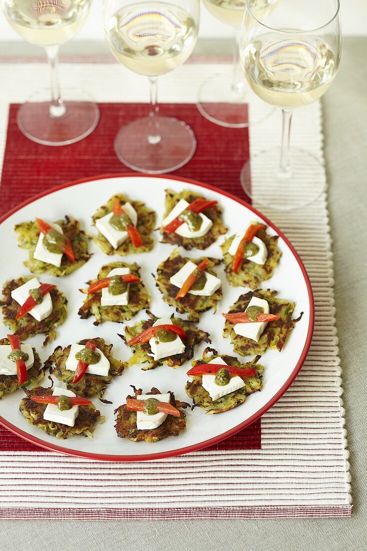 Courgette cakes with goat's cheese and pesto as finger food for a party
