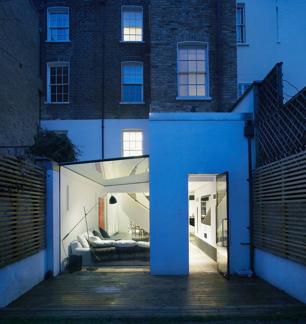 English town house with modern, renovated ground floor and view of illuminated living room