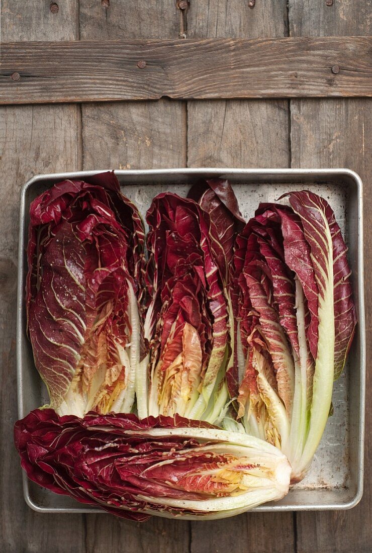 Treviso Radicchio from a Maine Farm; Drizzled with Olive Oil, Salt and Pepper in Preparation for Grilling.